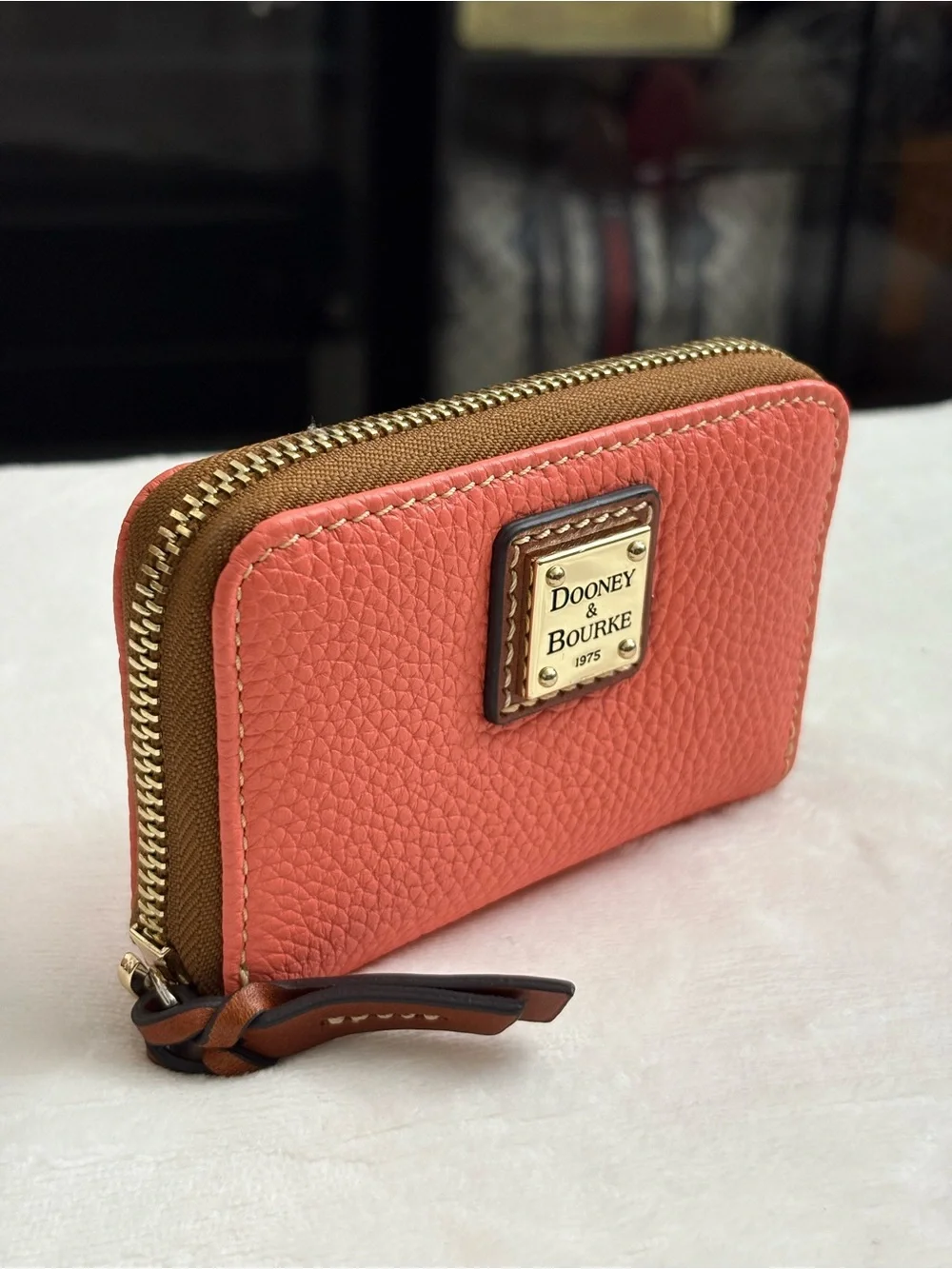 Dooney & Bourke Pebble Grain Large Zip Around Credit Card Case  Coral Color.